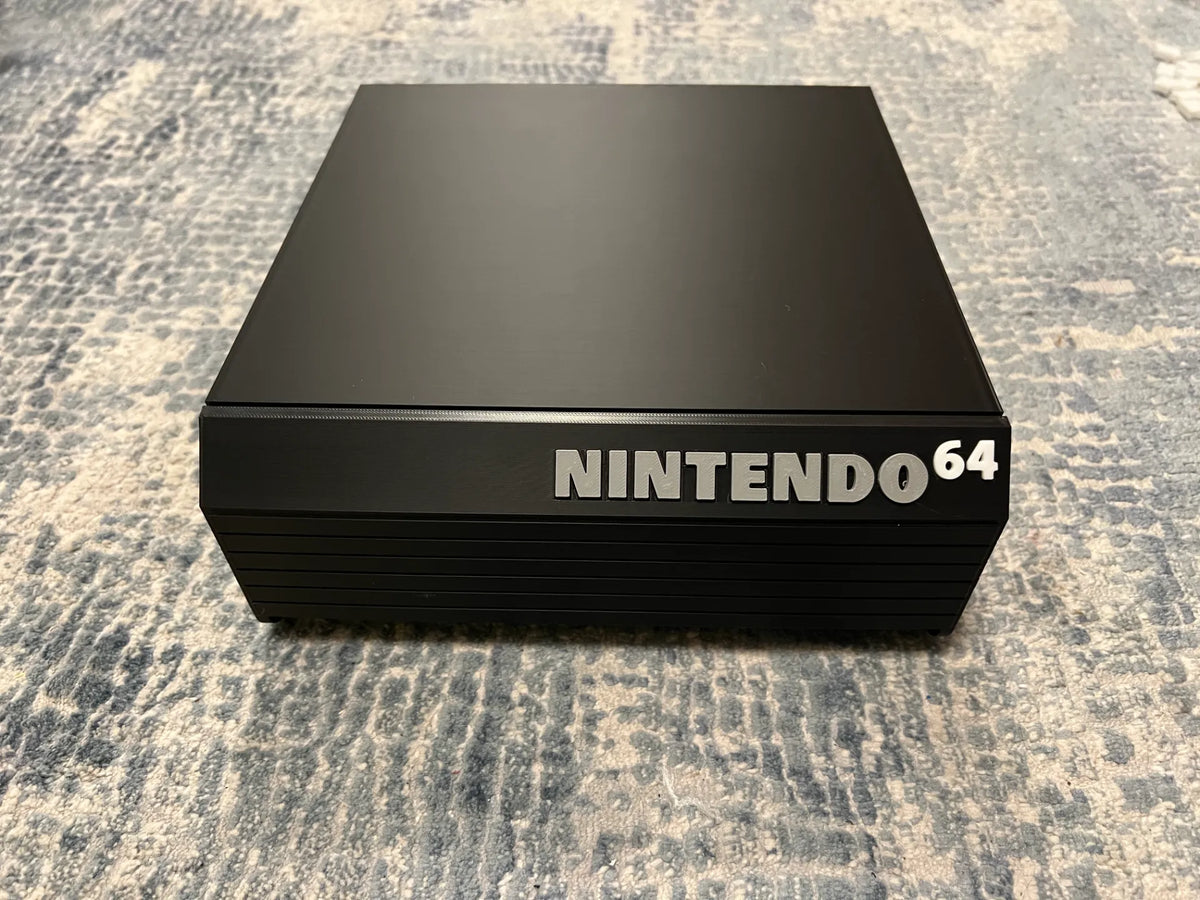 N64 cartridge drawer open with games