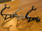 Three 3D printed Xbox 360 display stands in black and gray