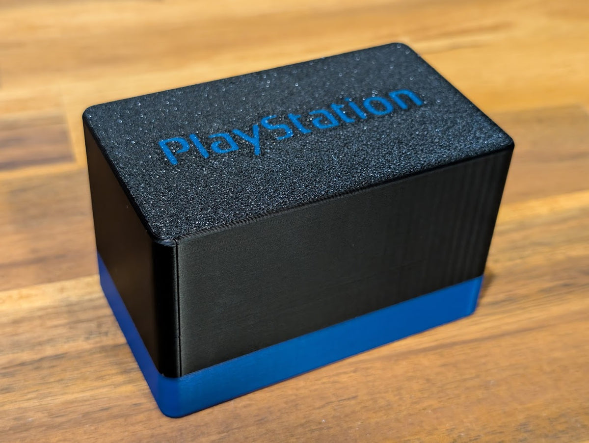 Black and blue memory card storage case with blue lettering