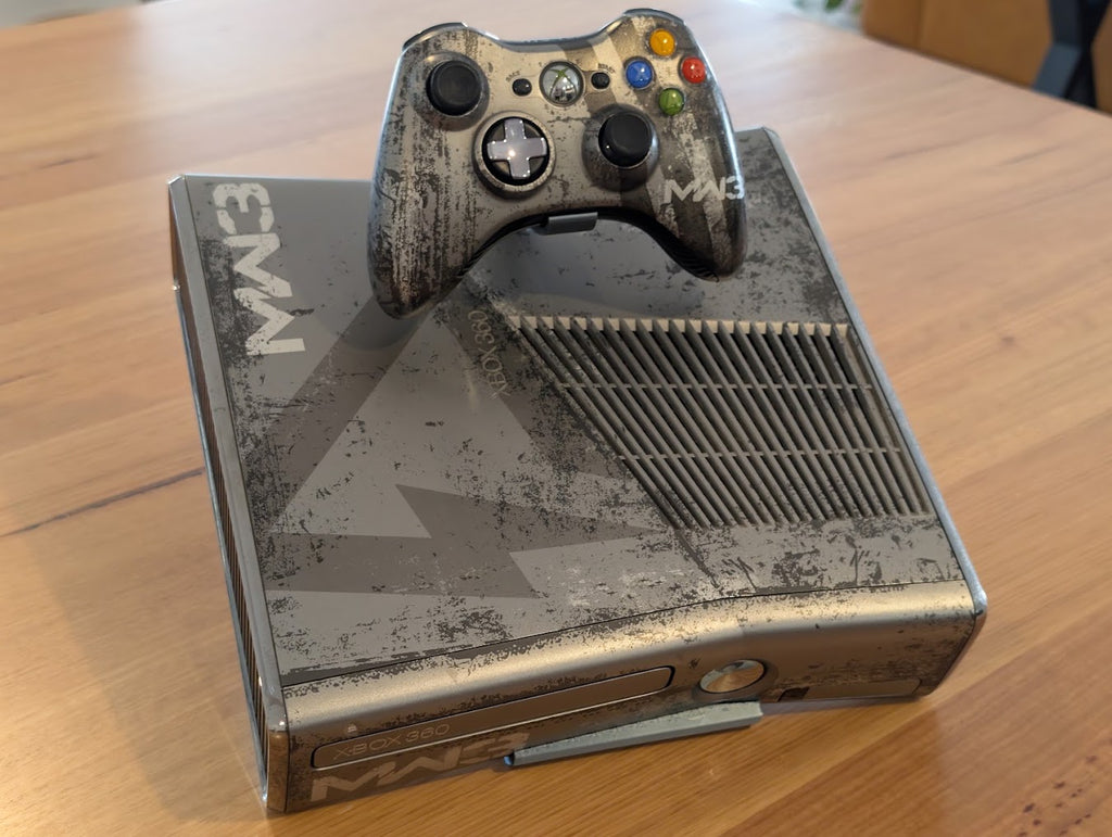 Xbox 360 S console with a controller on top of a 3D printed display stand