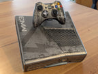 Xbox 360 S console with a controller on top of a 3D printed display stand