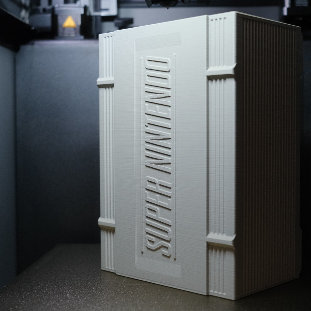 SNES cartridge storage case with embossed logo