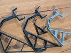 Close-up of Xbox 360 display stand frames for each console model